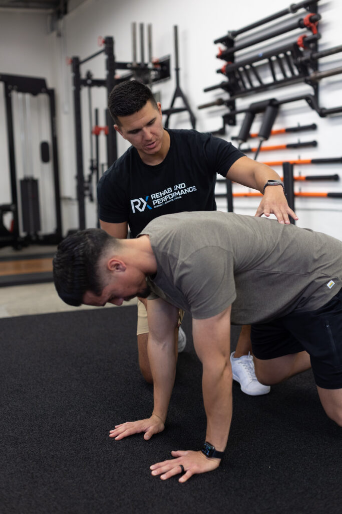Dr. Albert consulting with a new patient at Rx Rehab and Performance