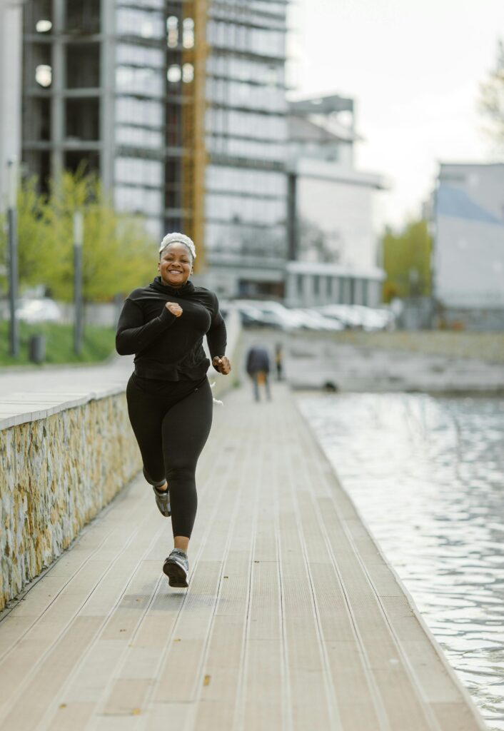 Woman running freely after completing knee rehabilitation program